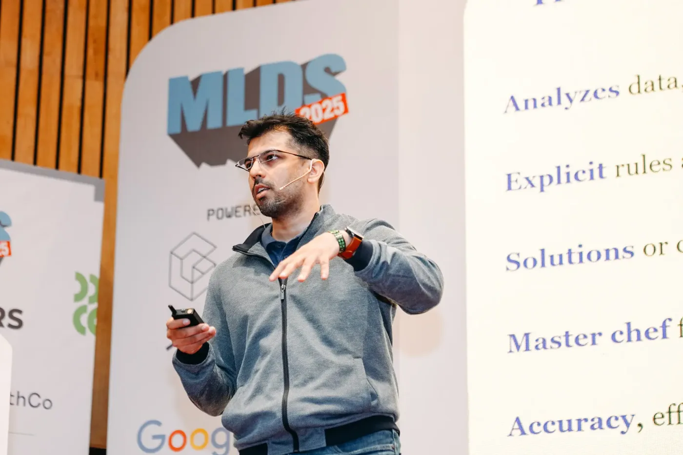 Speaker explaining agentic AI systems on the MLDS stage